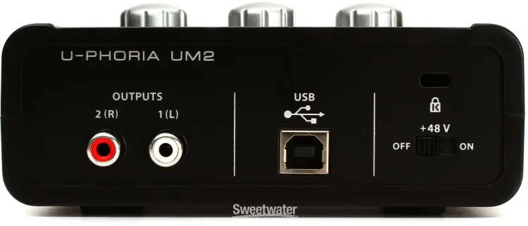 Back panel of the Behringer U-Phoria UM2. From left to right: two RCA output jacks labeled 2 (R) and 1 (L), a USB-B port, a Kensington security slot, and a +48V phantom power switch with off and on positions.