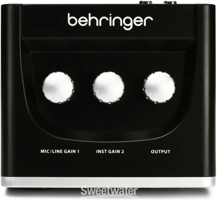 Top view of the Behringer U-Phoria UM2 showing three knobs labeled, left to right: Mic/Line Gain 1, Inst Gain 2, and Output.
